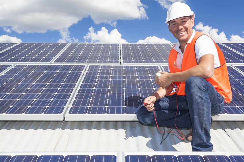 19798542 solar panel technician on roof